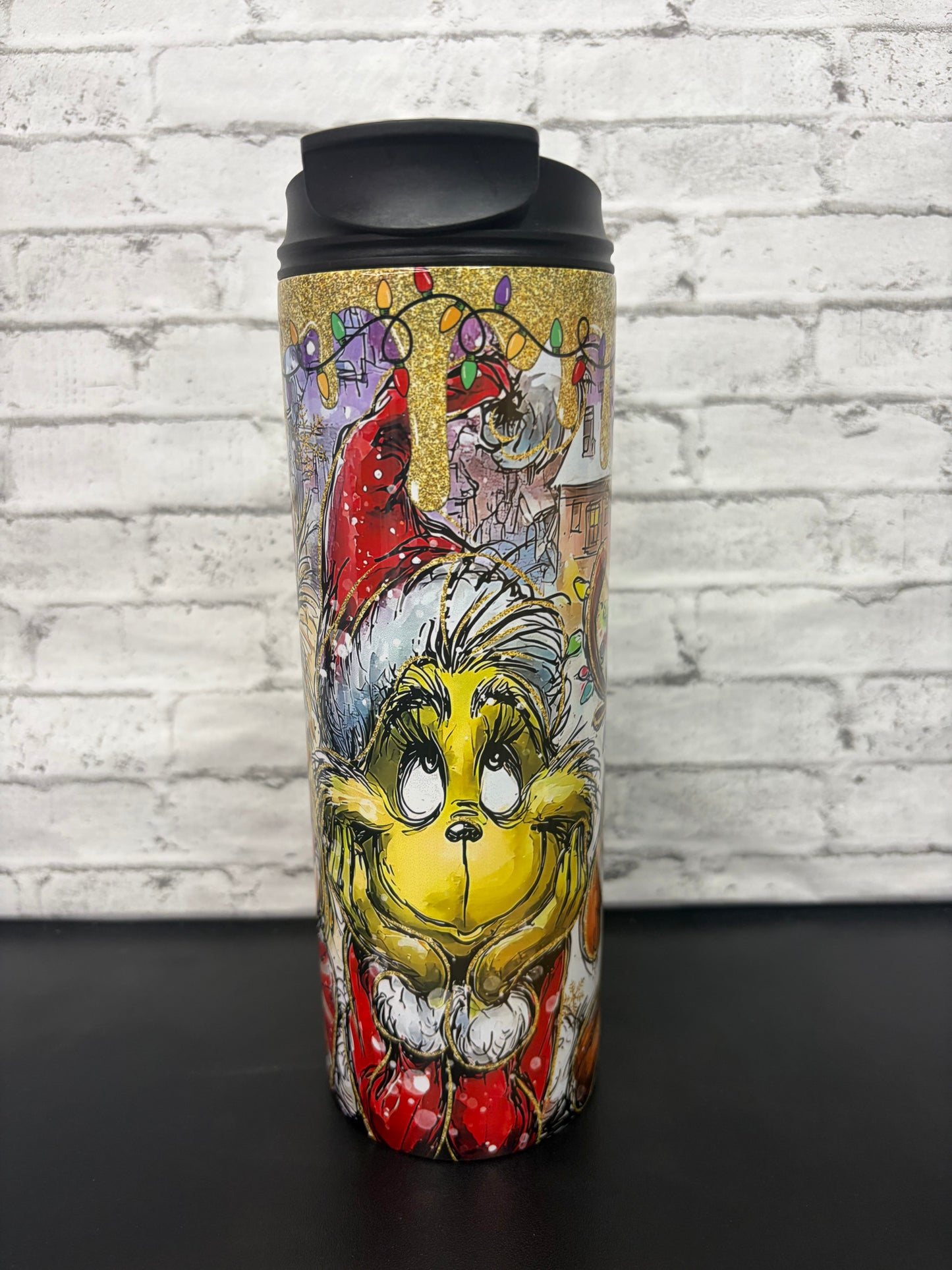 20 oz stainless steel tumbler, engineered for durability and portability Featuring vibrant Grinch-inspired artwork