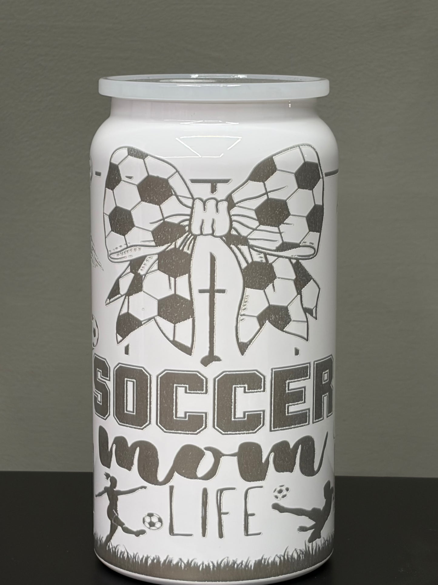 16oz stainless steel tumbler laser-engraved with a distinctive mom soccer design