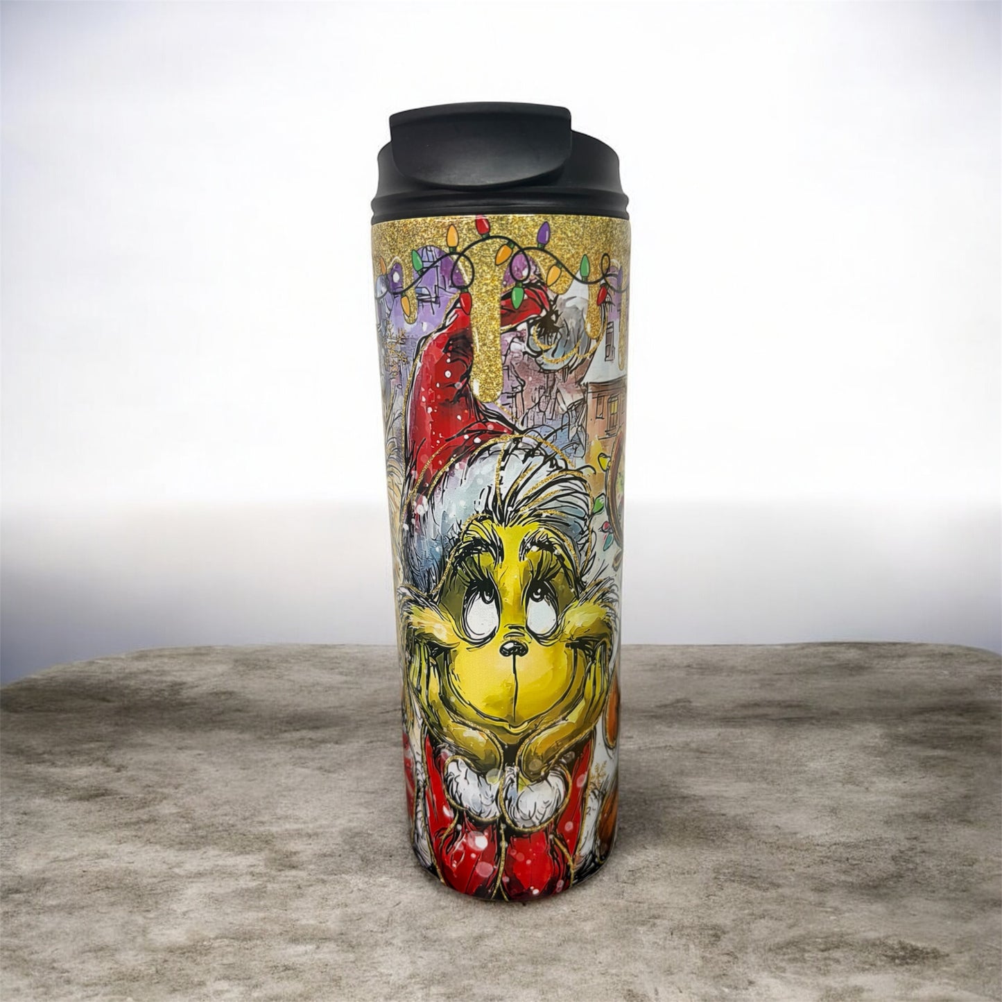 20 oz stainless steel tumbler, engineered for durability and portability Featuring vibrant Grinch-inspired artwork